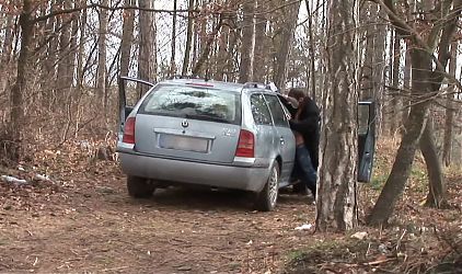 Masked man fucks hardcore woman in car in a forest